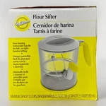 Wilton Flour Sifter 2.5 Cups Capacity Ambidextrous Easy Turning Handle Brand New. Fixed Price $15.15.