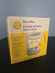Wilton Flour Sifter 2.5 Cups Capacity Ambidextrous Easy Turning Handle Brand New. Fixed Price $14.00.