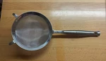 Le Creuset Revolution Mesh Strainer. Fixed Price $80.00.