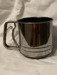 America Cooks Stainless Steel 5 Cup Easy Squeeze Handle Sifter. Fixed Price $8.50.