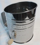 Mrs. Anderson's 5 Cup Stainless Steel Rotary Hand Crank Flour Sifter. Fixed Price $9.00.