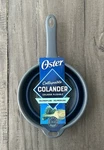 Oster Bluemarine Collapsible Polypropylene Colander With Handle, Style # 130002. Fixed Price $14.42.