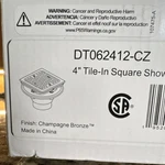 Delta DT062412-CZ 4" Square Shower Drain Grate Champagne Bronze. Fixed Price $65.00.
