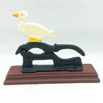 Cast Iron White Duck Nutcracker Wooden Base. Fixed Price $11.95.