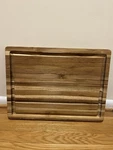 Teakhaus By Proteak Edge Grain Cutting Board W/hand Grip + Juice Canal. Fixed Price $79.00.