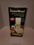 The Kitchen Wizzard. Total Slicer, Dicer, Grater, Shredder, Chopper. Plastic. Fixed Price $20.00.