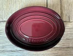 Le Creuset Stoneware Oval Spoon Rest Garnet Rhone. Fixed Price $34.99.