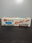 Reed's Rocket Nut Cracker, Early Model 800, Patent Pending Sticker - Nib White. Fixed Price $15.86.